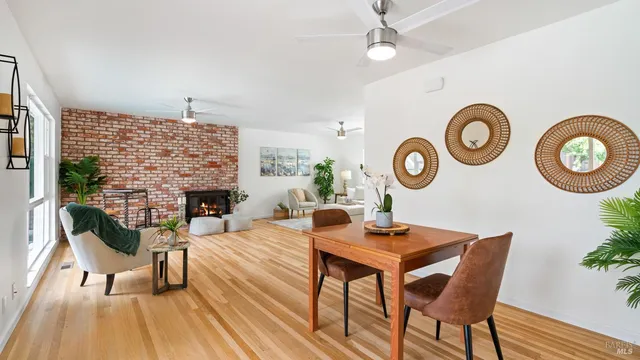 a dining room with furniture and a fireplace