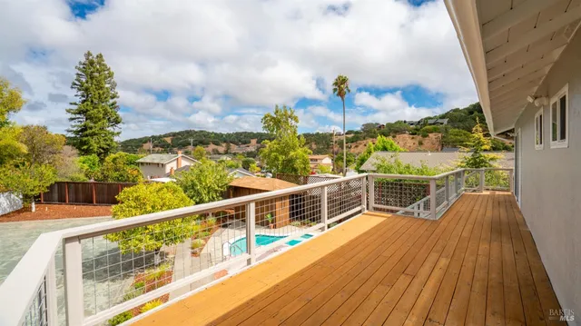a view of balcony with furniture