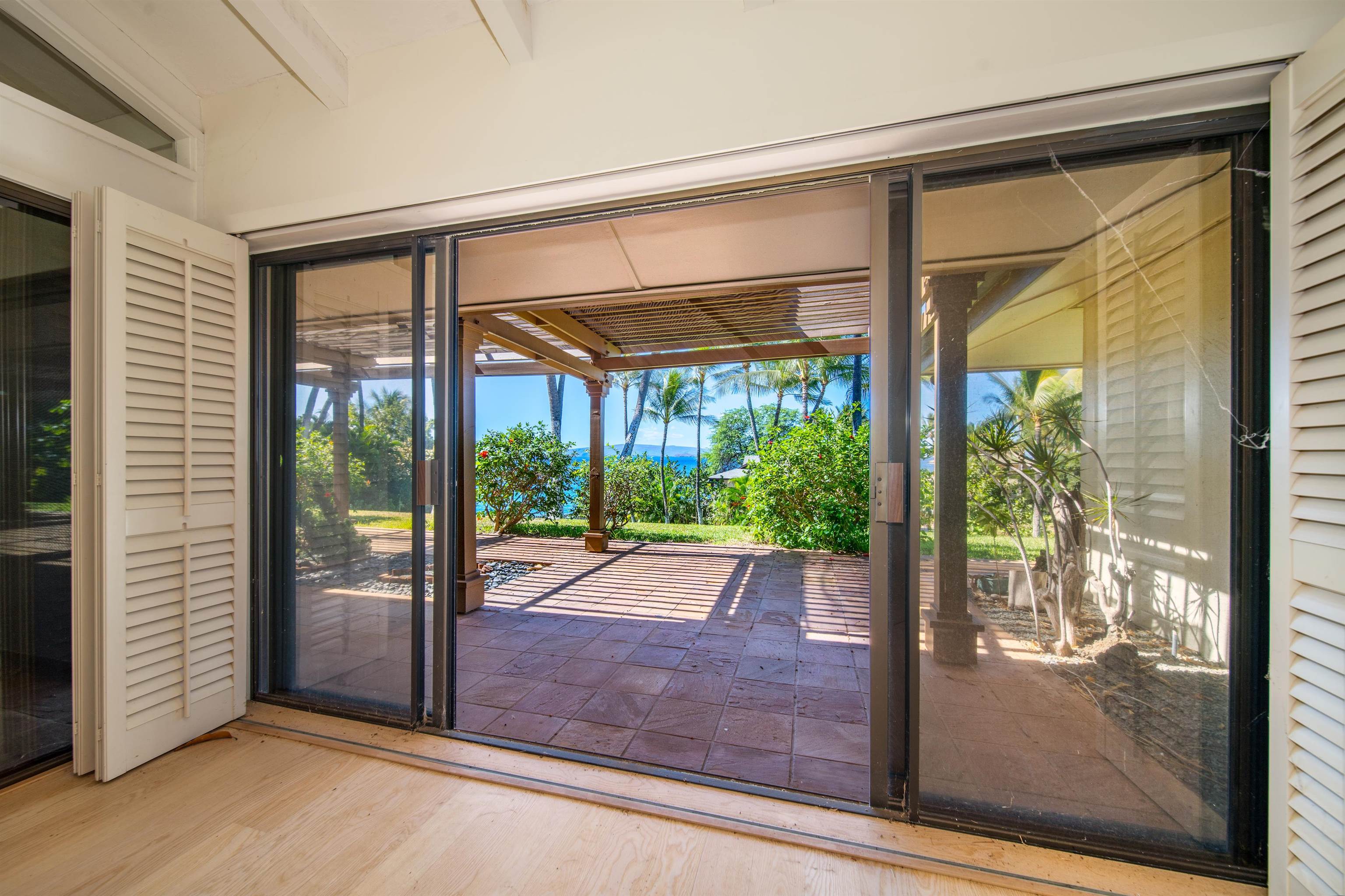 4584 Makena Road Kihei, HI 96753 - Photo 18 of 30 a porch with a glass door