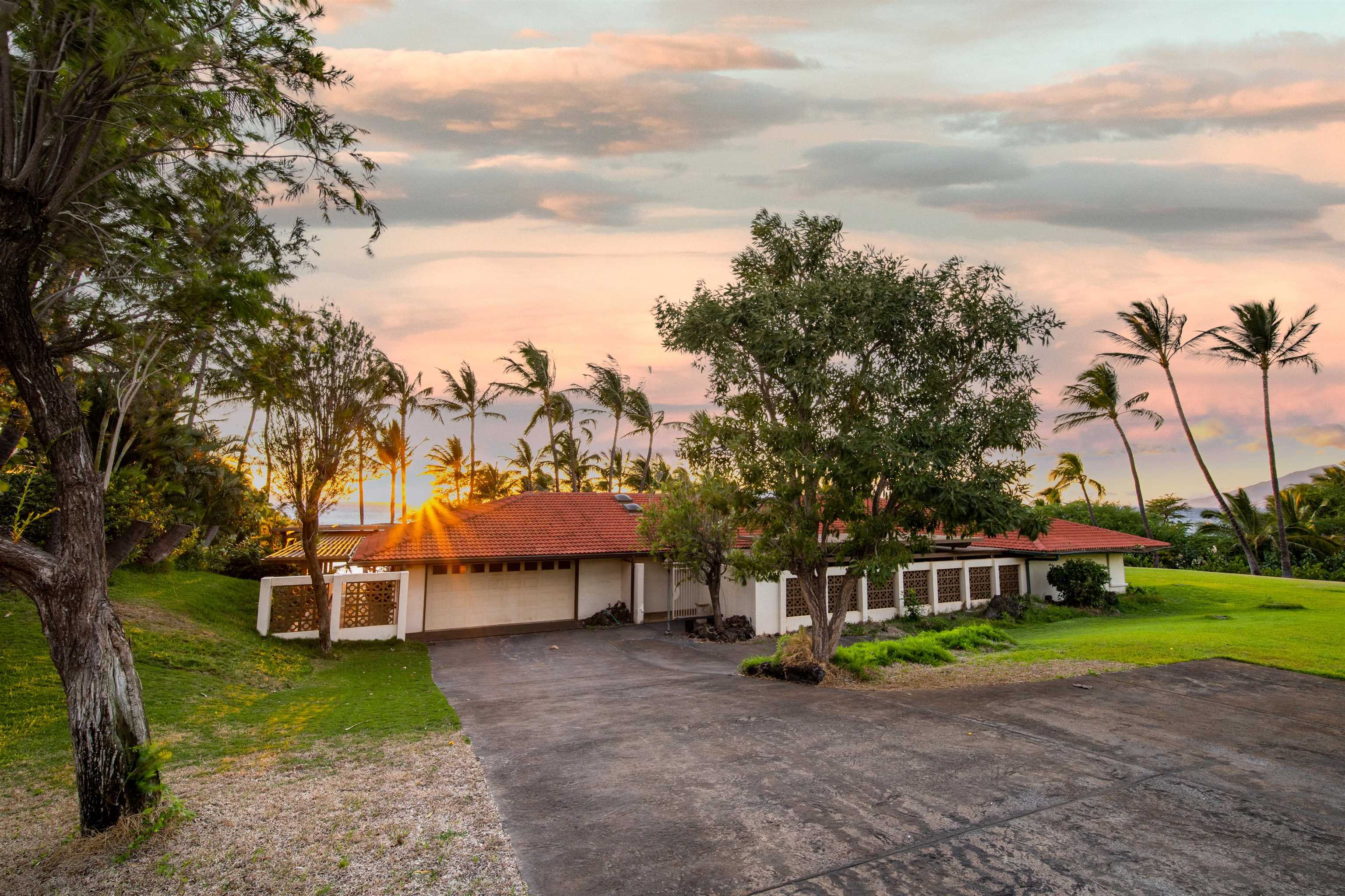 4584 Makena Road Kihei, HI 96753 - Photo 29 of 30 a view of a house with a big yard and large trees