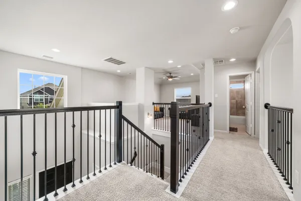 a view of a hallway with a kitchen