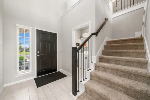 a view of entryway with stairs and furniture