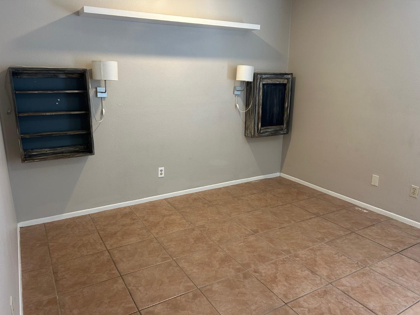 1320 West 3rd Street, Unit 2 Tempe, AZ 85281 - Photo 8 of 10 a view of an empty room with cabinet and a window