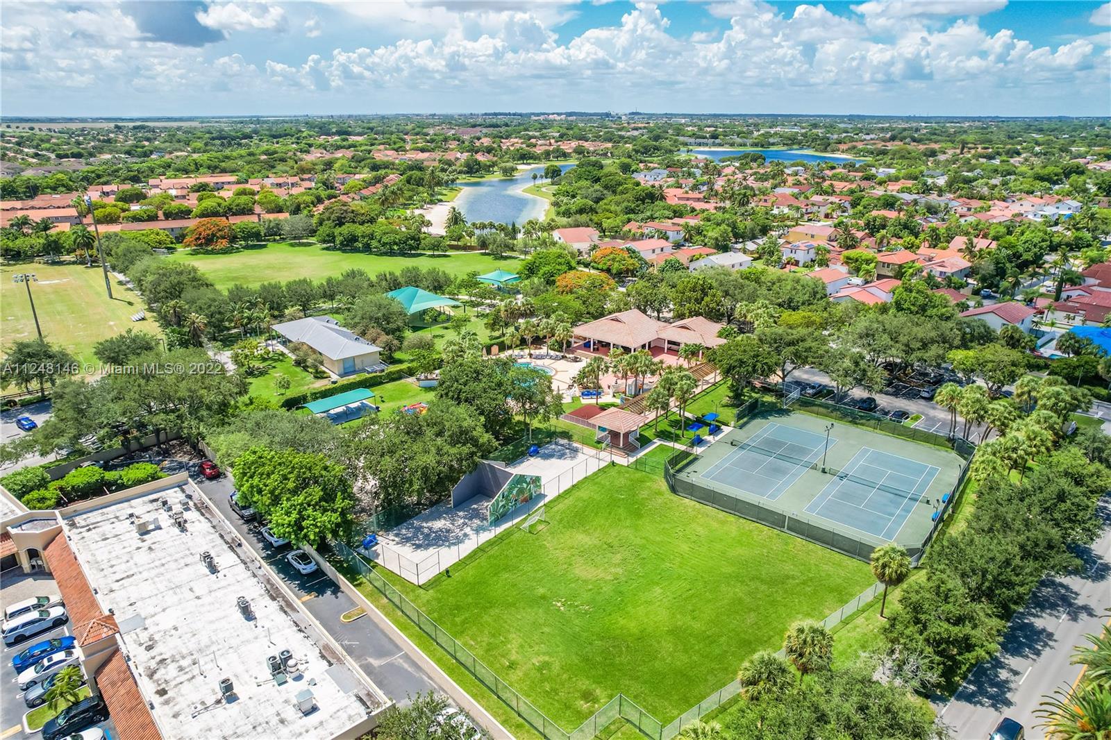 10505 Southwest 153rd Court, Unit 2 Miami, FL 33196 - Photo 11 of 39 an aerial view of residential houses with outdoor space and trees