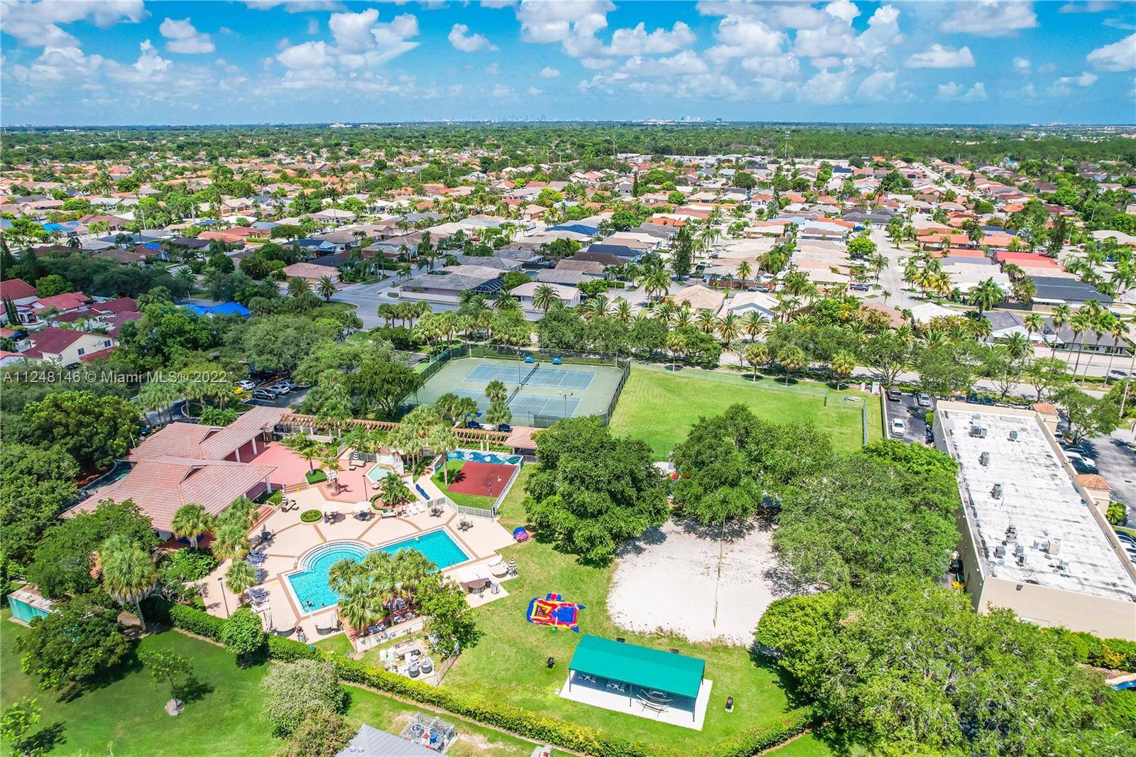 10505 Southwest 153rd Court, Unit 2 Miami, FL 33196 - Photo 13 of 39 an aerial view of residential houses with outdoor space and trees all around