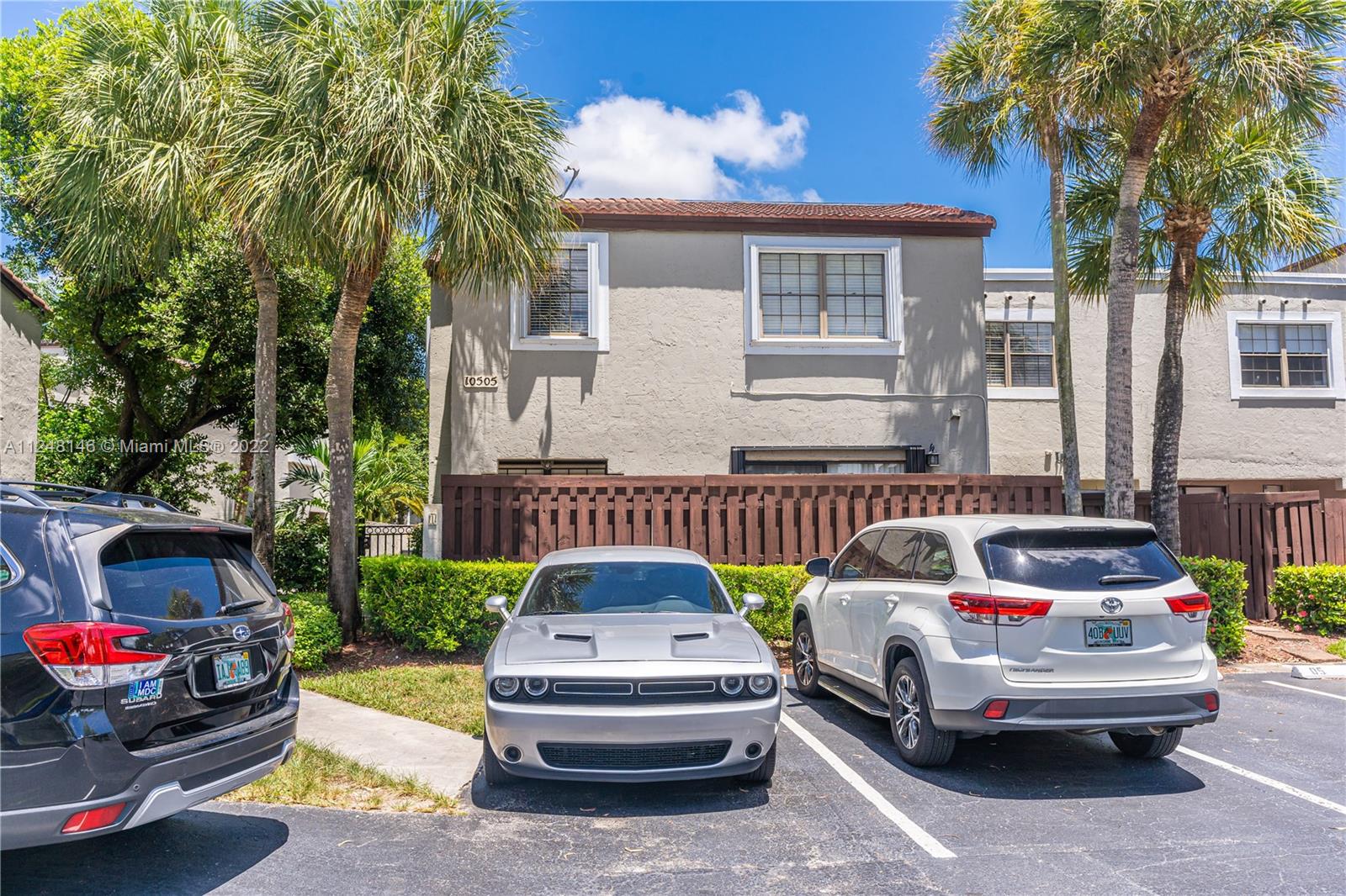 10505 Southwest 153rd Court, Unit 2 Miami, FL 33196 - Photo 15 of 39 a car parked in front of a house