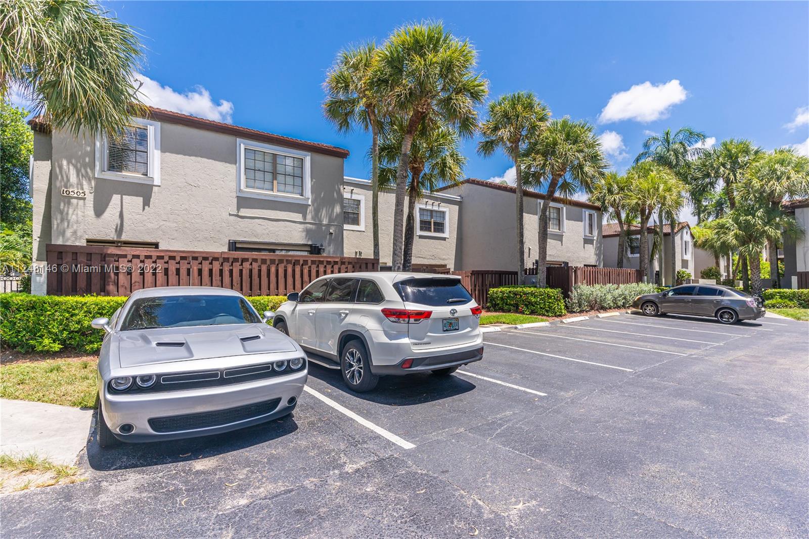 10505 Southwest 153rd Court, Unit 2 Miami, FL 33196 - Photo 16 of 39 a front view of a house with garden