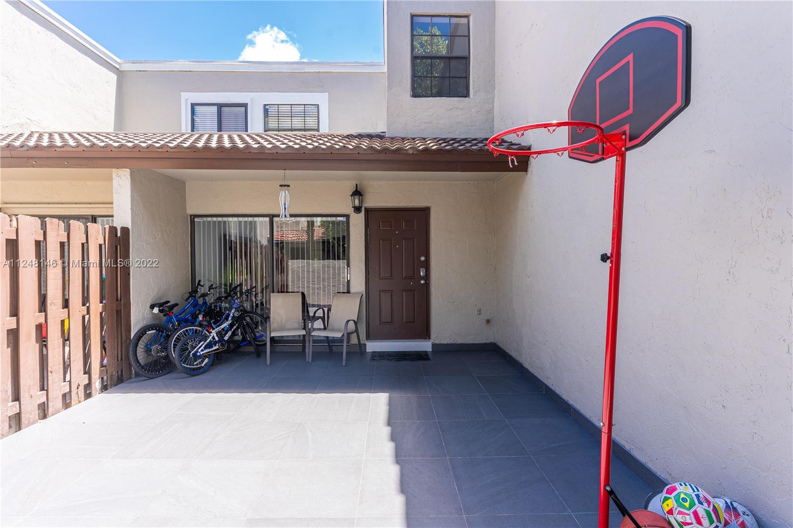 10505 Southwest 153rd Court, Unit 2 Miami, FL 33196 - Photo 19 of 39 a dining room with furniture and a floor to ceiling window