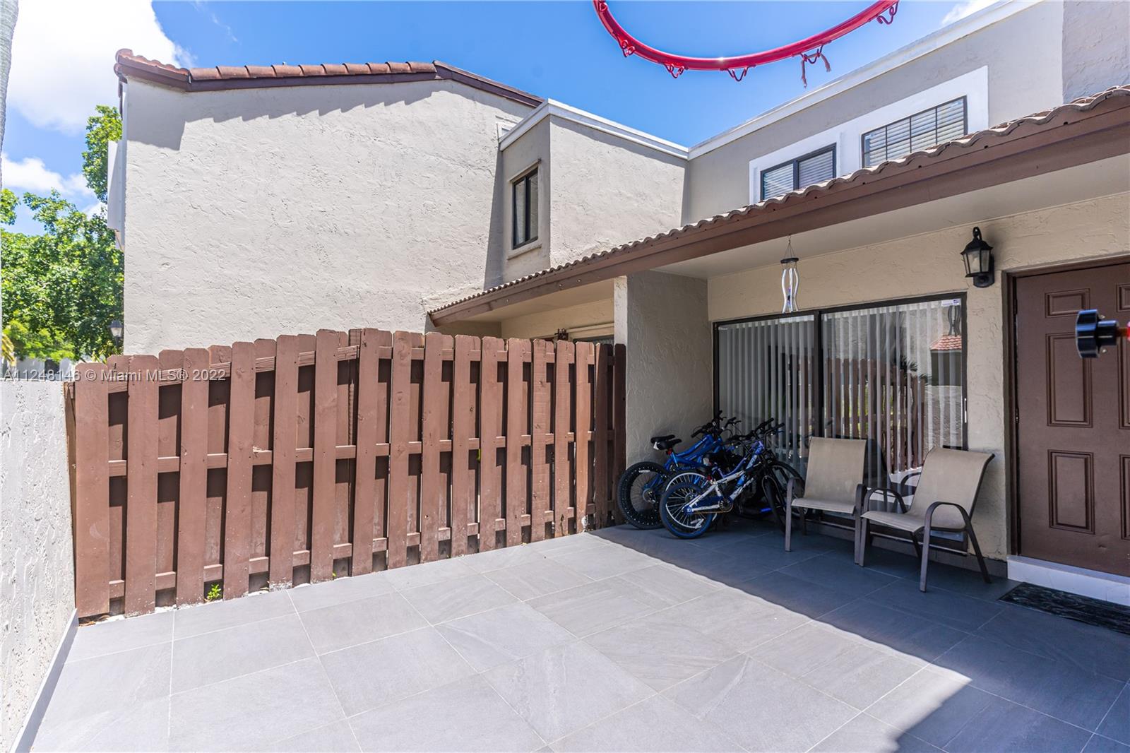 10505 Southwest 153rd Court, Unit 2 Miami, FL 33196 - Photo 20 of 39 a view of a chairs in front of house
