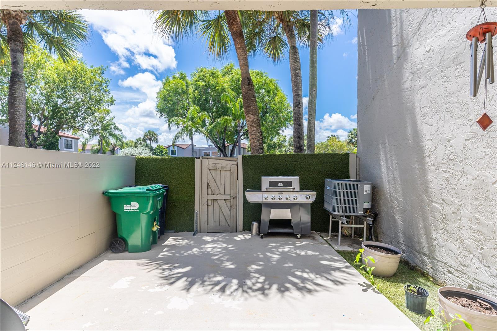 10505 Southwest 153rd Court, Unit 2 Miami, FL 33196 - Photo 21 of 39 a backyard of a house with outdoor seating