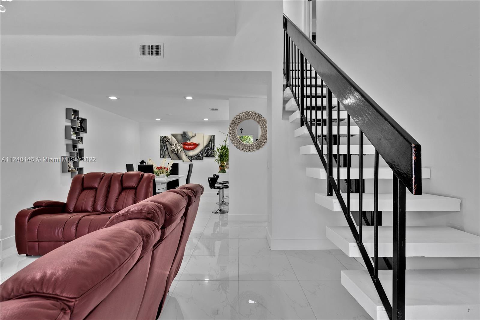10505 Southwest 153rd Court, Unit 2 Miami, FL 33196 - Photo 23 of 39 a living room with furniture and stairs