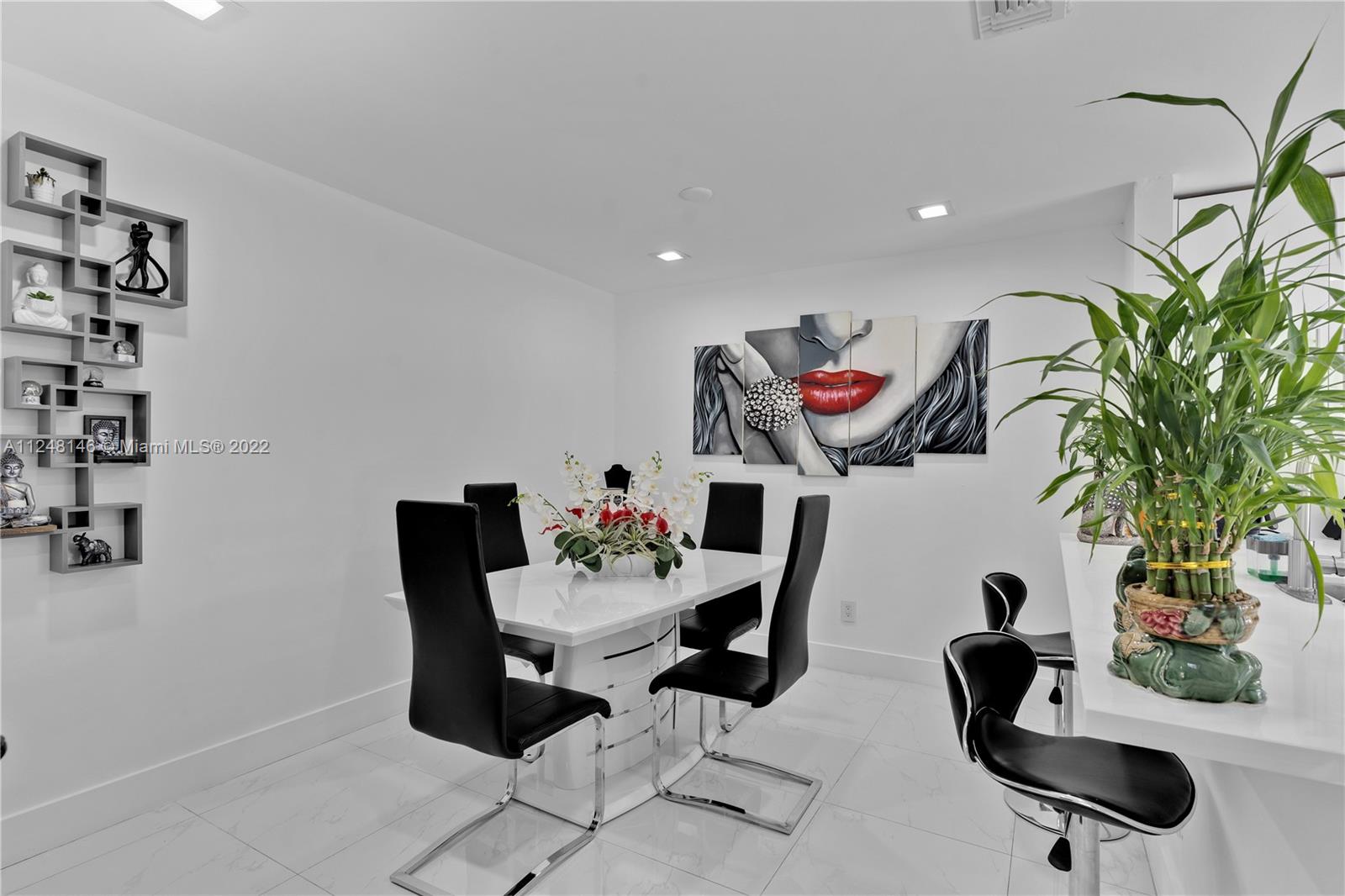 10505 Southwest 153rd Court, Unit 2 Miami, FL 33196 - Photo 25 of 39 a living room with furniture potted plant and a large window