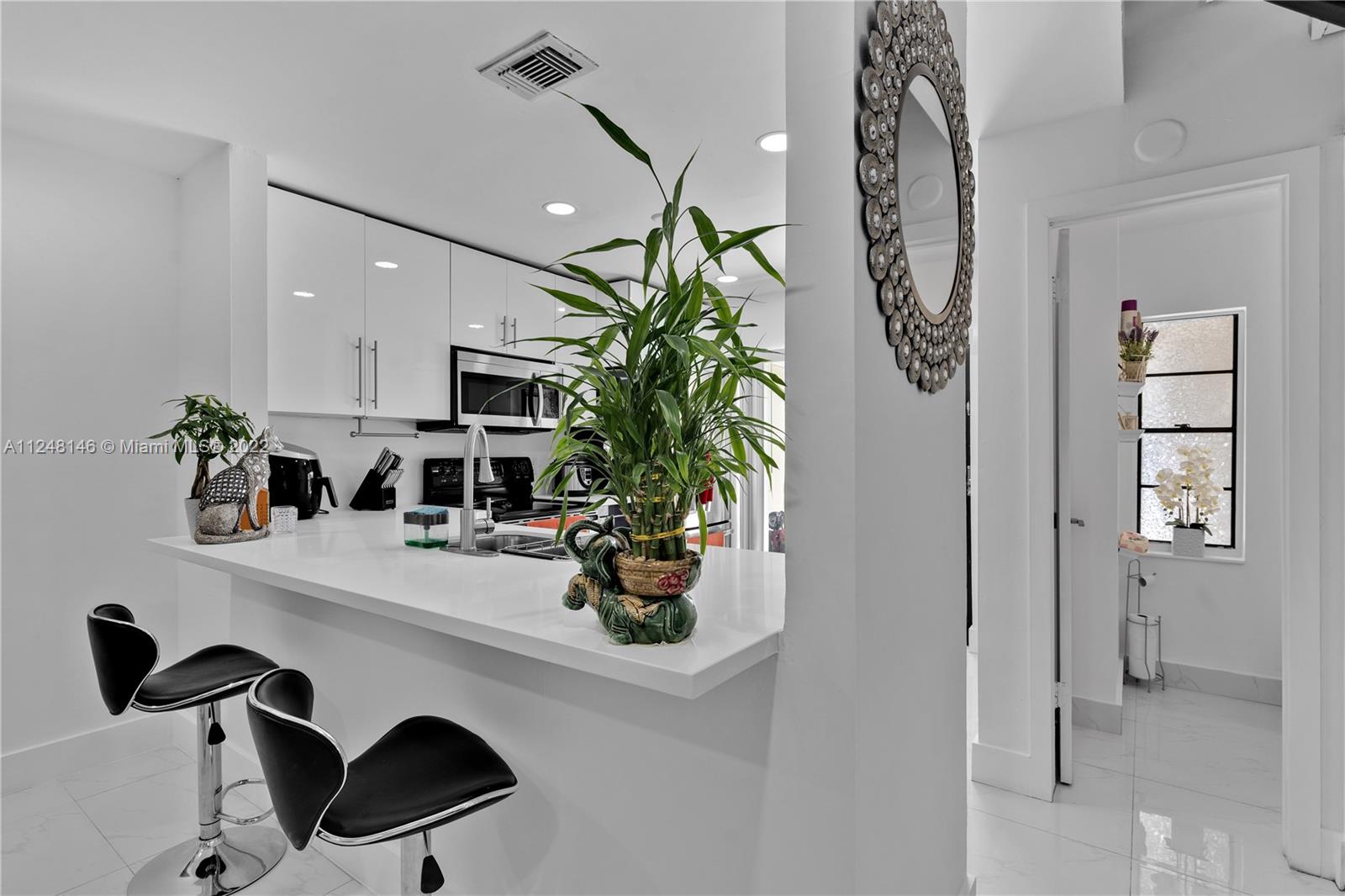 10505 Southwest 153rd Court, Unit 2 Miami, FL 33196 - Photo 27 of 39 a view of living room with furniture and potted plant