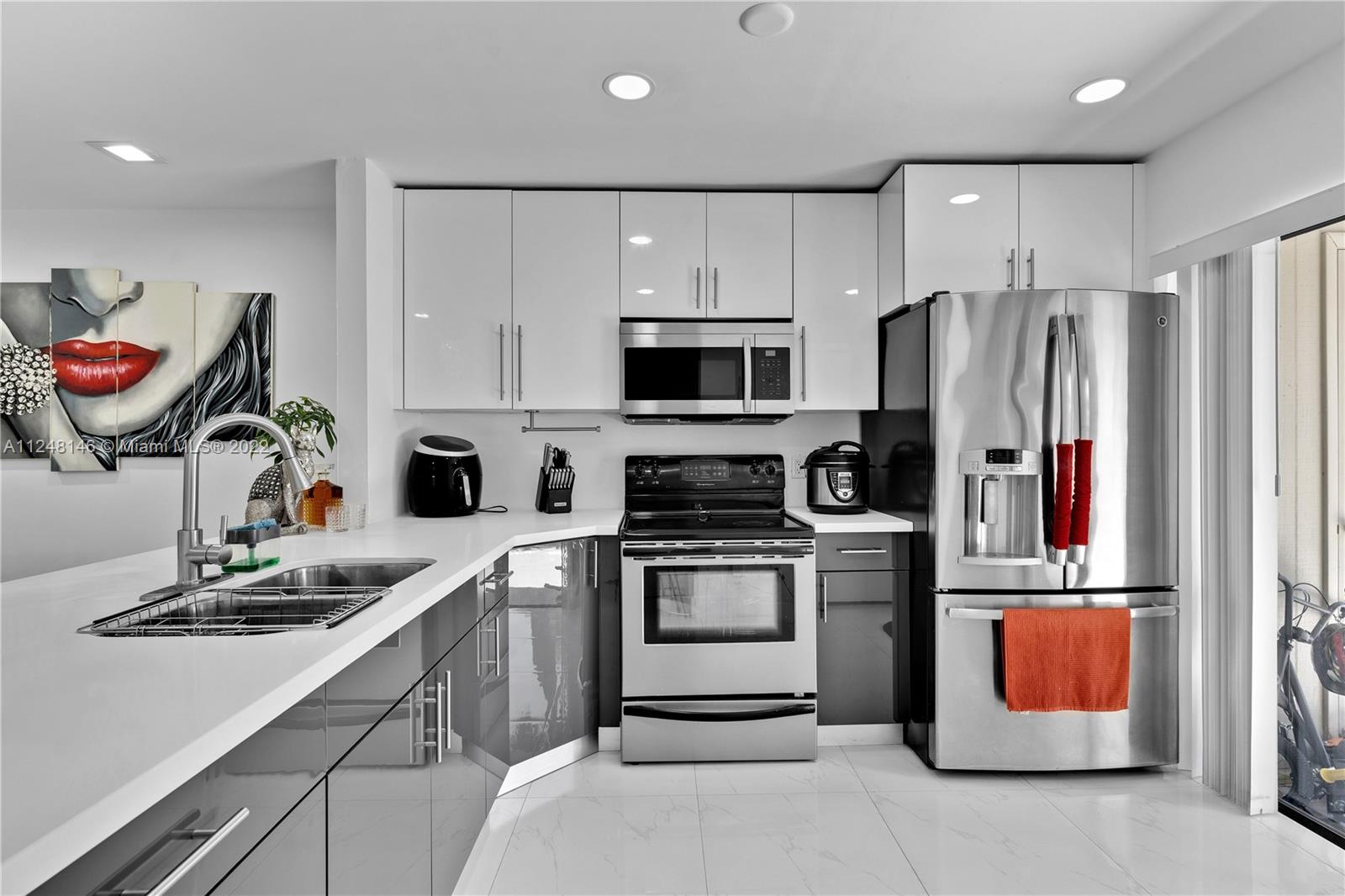 10505 Southwest 153rd Court, Unit 2 Miami, FL 33196 - Photo 28 of 39 a kitchen with granite countertop stainless steel appliances and sink