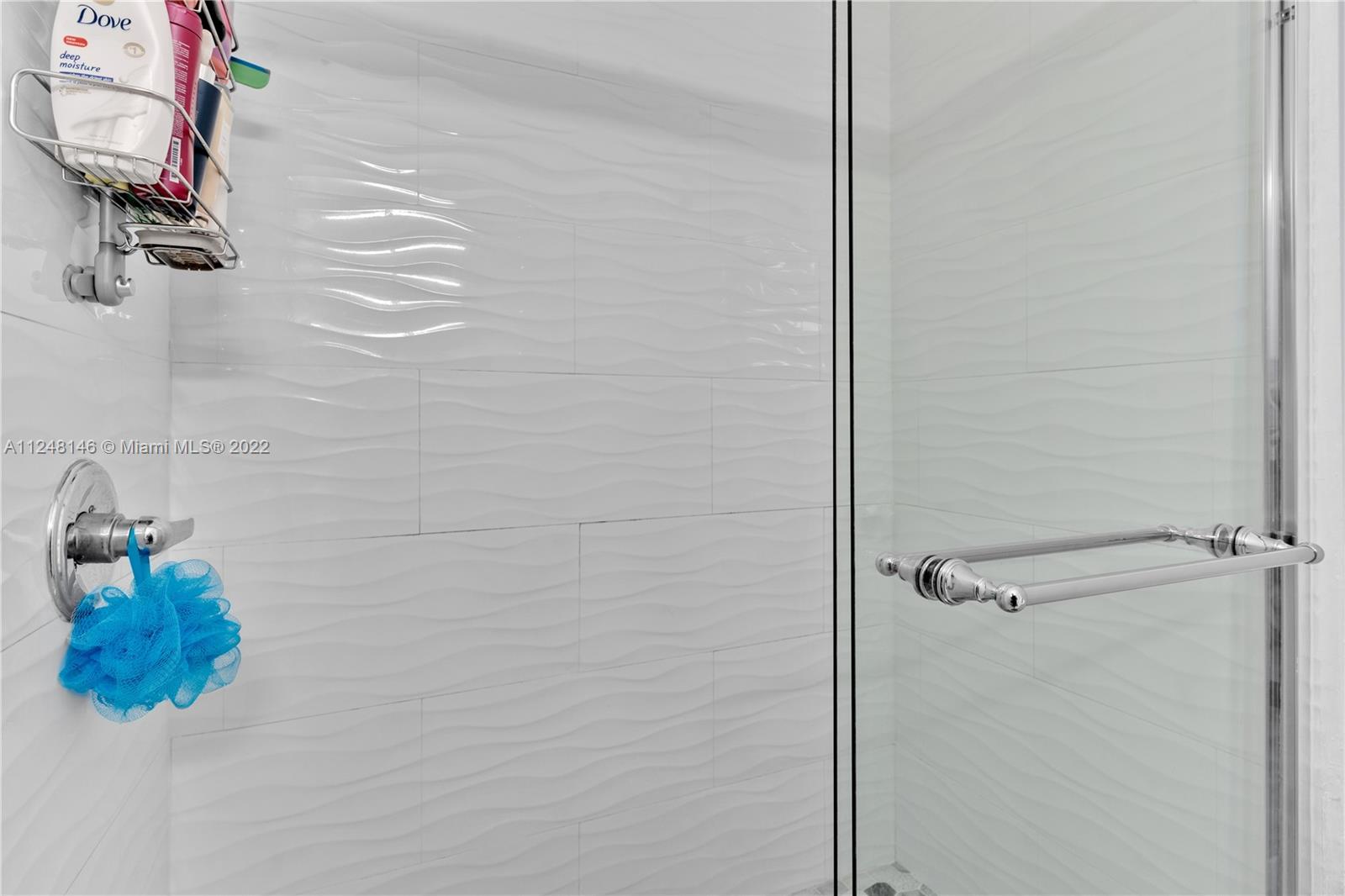 10505 Southwest 153rd Court, Unit 2 Miami, FL 33196 - Photo 37 of 39 a bathroom with a shower