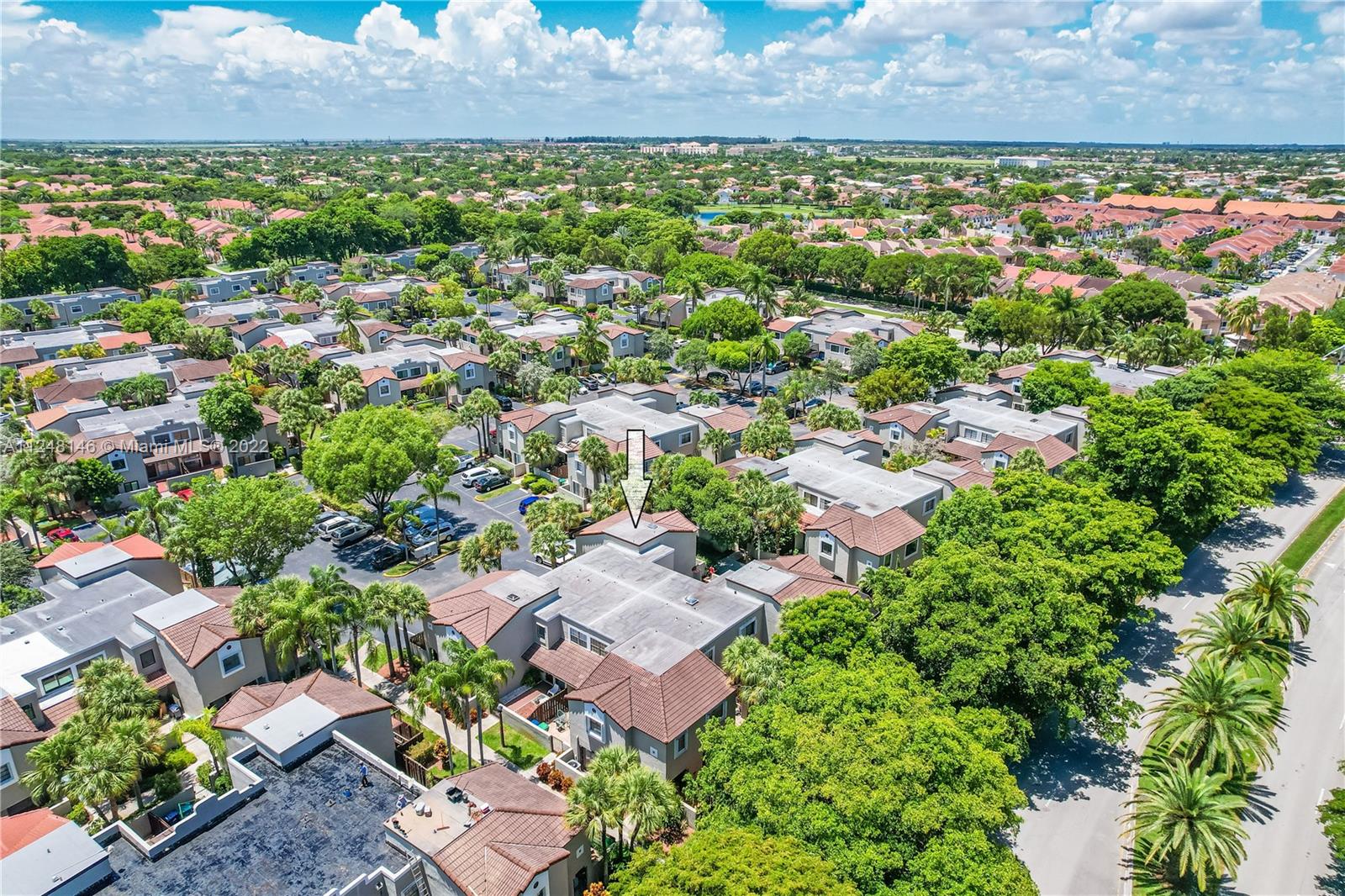10505 Southwest 153rd Court, Unit 2 Miami, FL 33196 - Photo 4 of 39 an aerial view of residential houses with outdoor space and trees