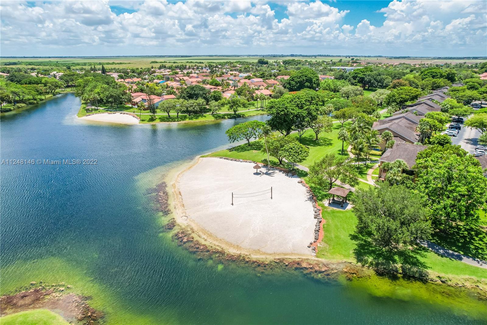 10505 Southwest 153rd Court, Unit 2 Miami, FL 33196 - Photo 10 of 39 an aerial view of a house with a yard and lake view