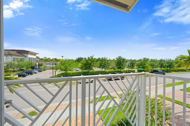 a view of a balcony with chairs
