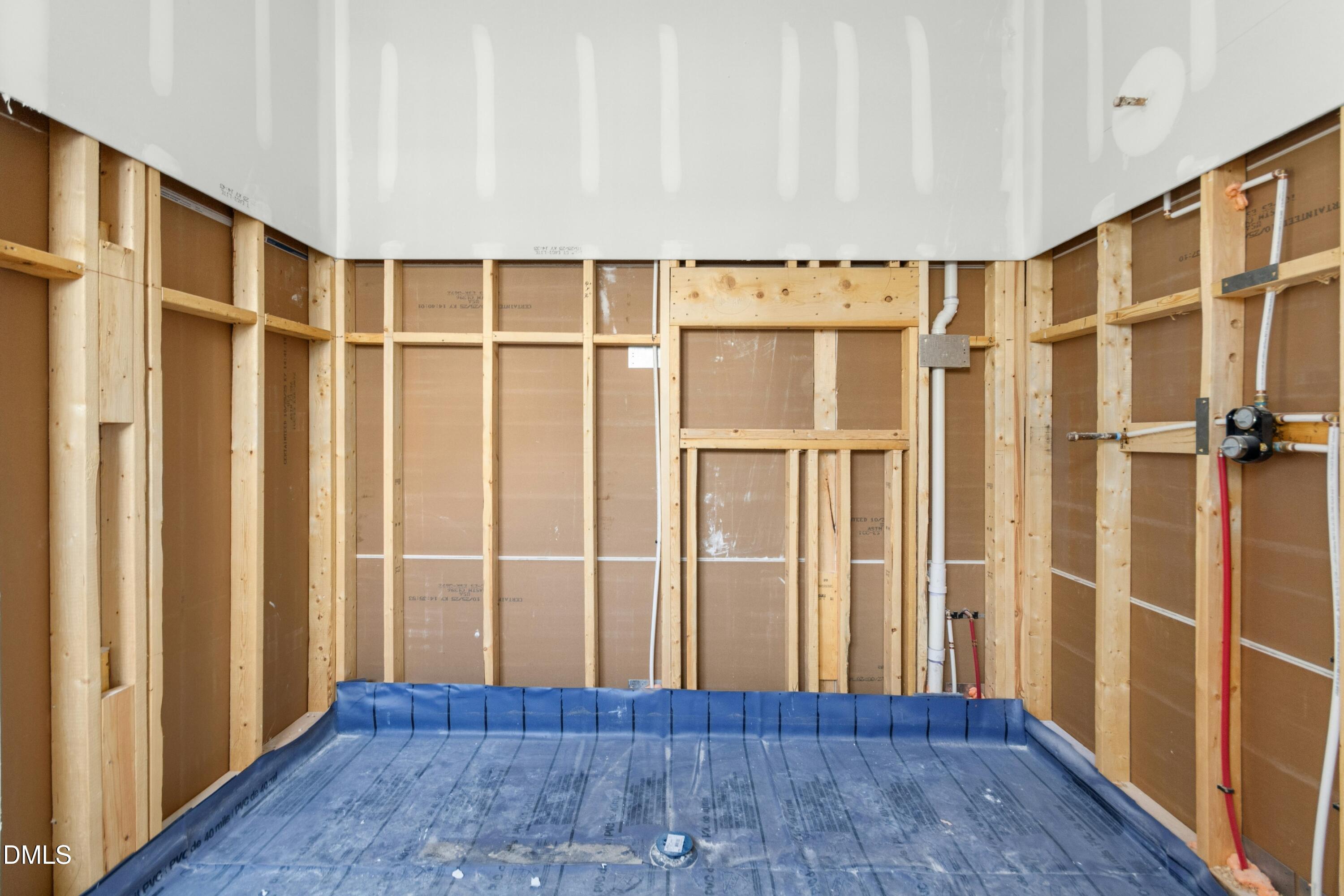 2024 Cadenza Lane Raleigh, NC 27614 - Photo 9 of 29 a view of a hallway with wooden floor and staircase