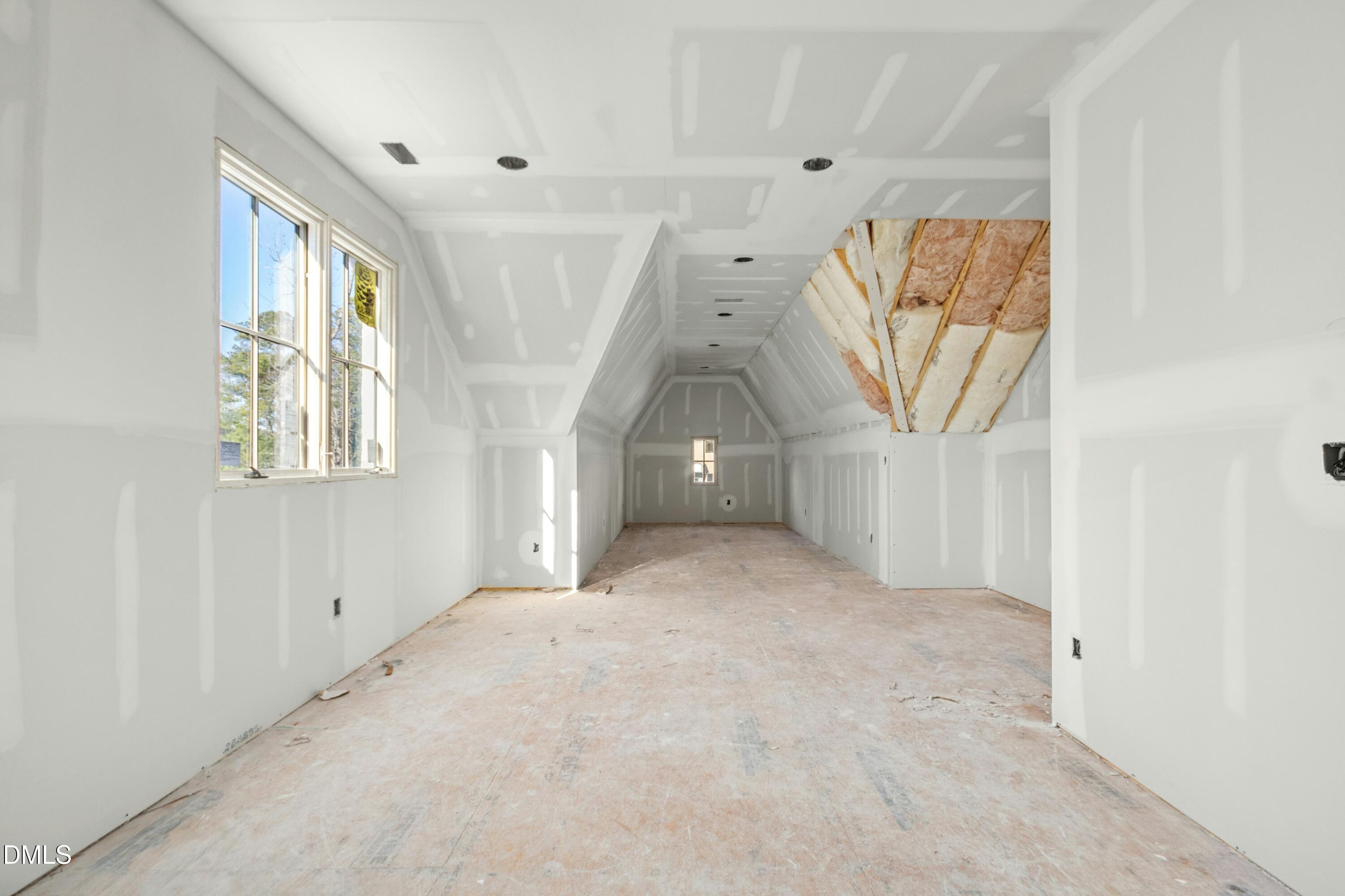 2024 Cadenza Lane Raleigh, NC 27614 - Photo 10 of 29 an empty room with windows and stairs