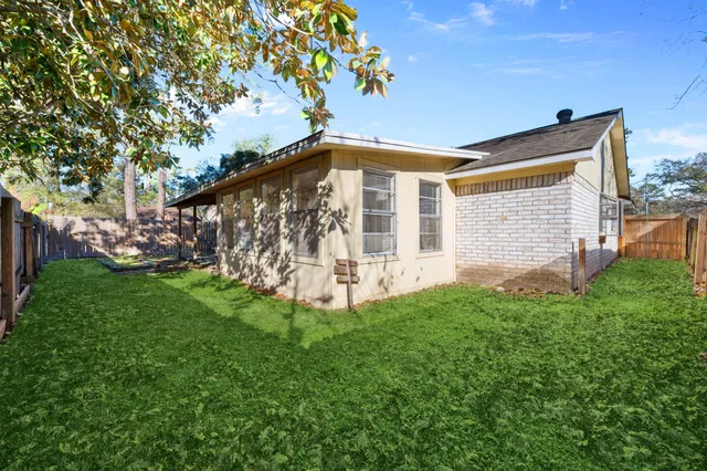 a view of a back yard of the house