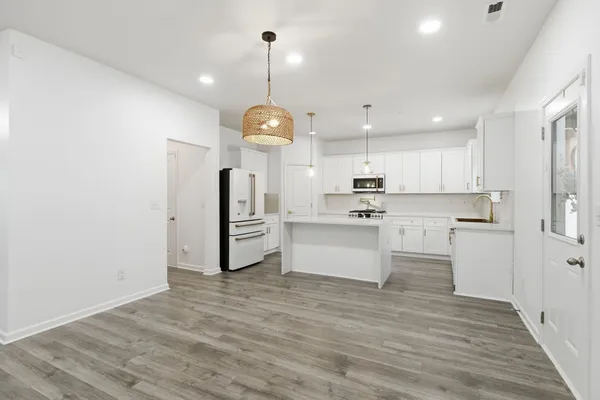 a view of kitchen with wooden floor