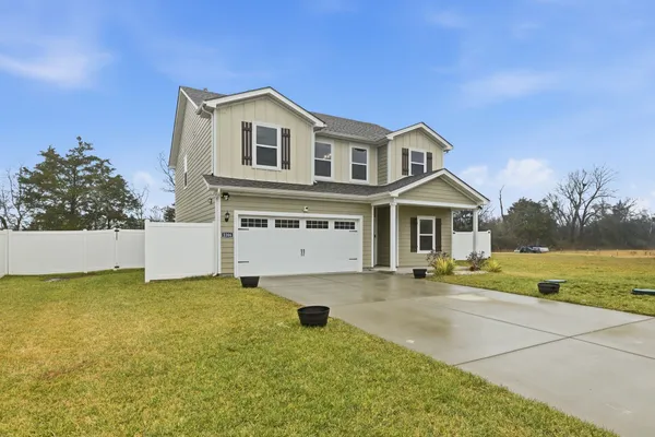 a front view of a house with a yard