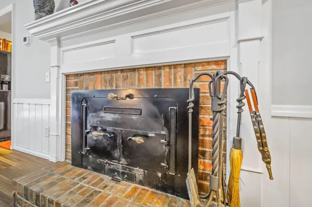 a bedroom with a bed and a mirror