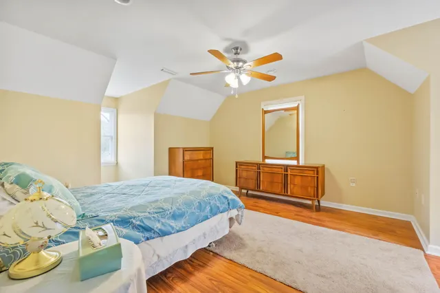 a bedroom with a bed and a dresser