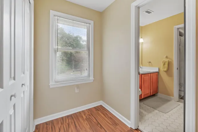 a view of room with window and bathroom view