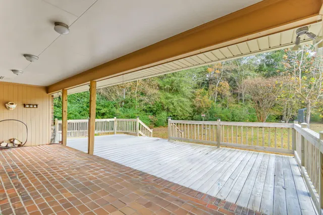 a view of a balcony with wooden floor