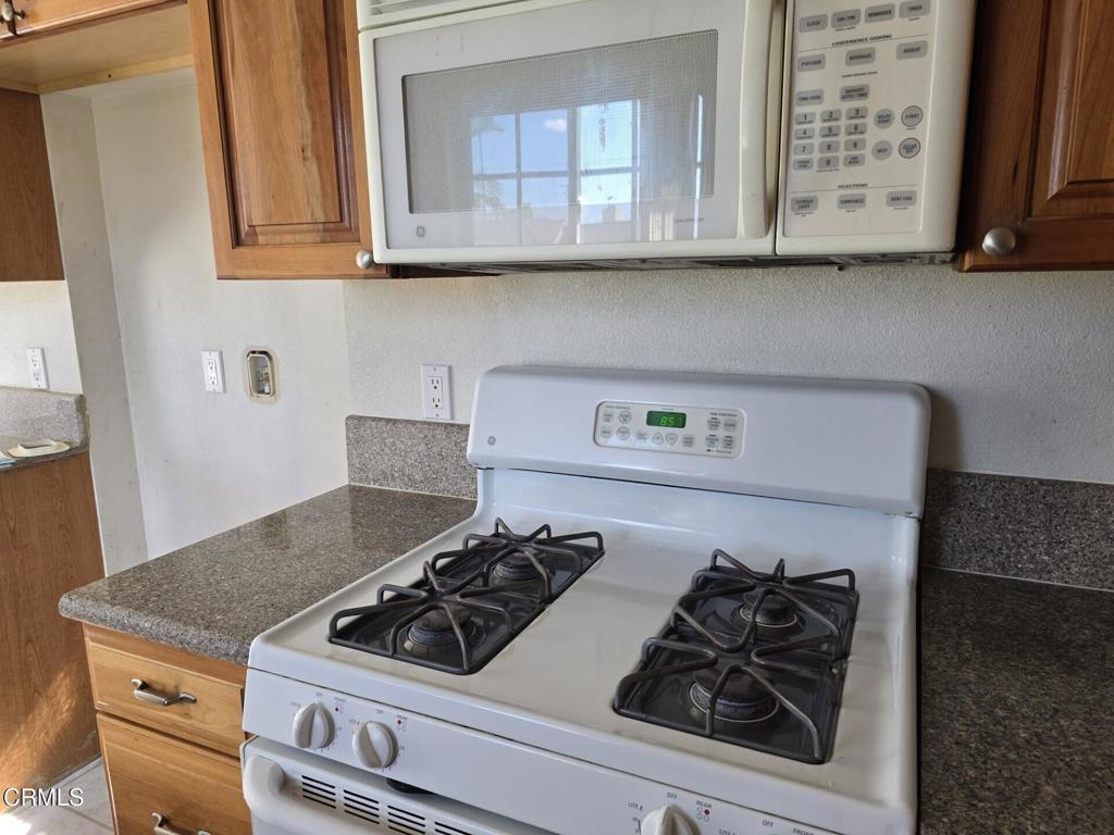 326 Simon Way Oxnard, CA 93036 - Photo 4 of 10 a stove top oven sitting inside of a kitchen