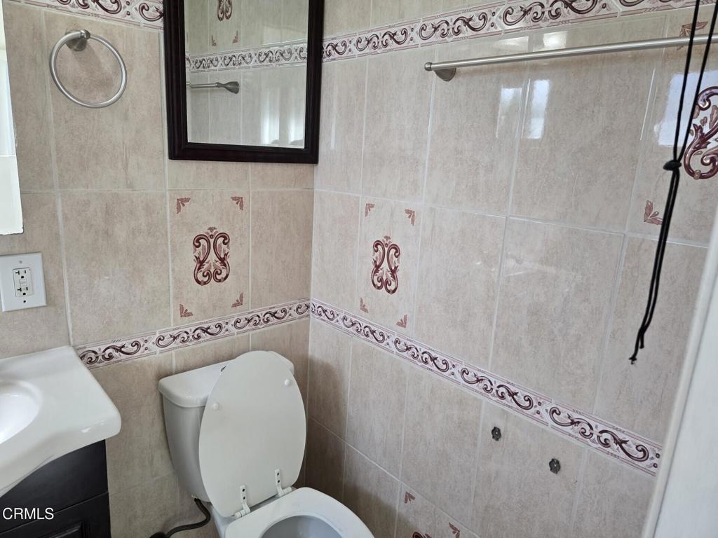 326 Simon Way Oxnard, CA 93036 - Photo 7 of 10 a bathroom with a toilet sink and mirror