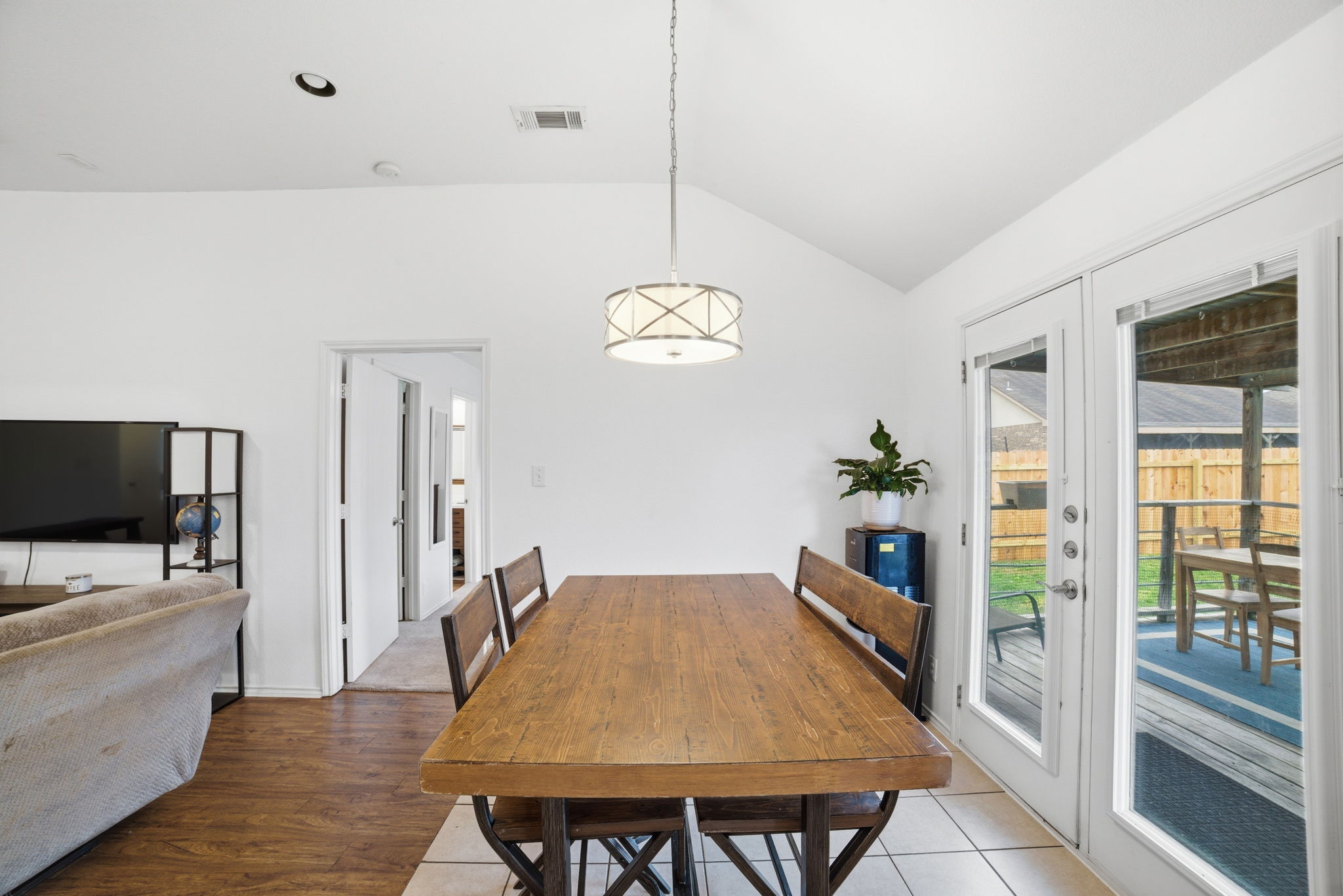 411 Copper Lane Jarrell, TX 76537 - Photo 11 of 32 Glass back doors allow for lots of natural light in the main areas.