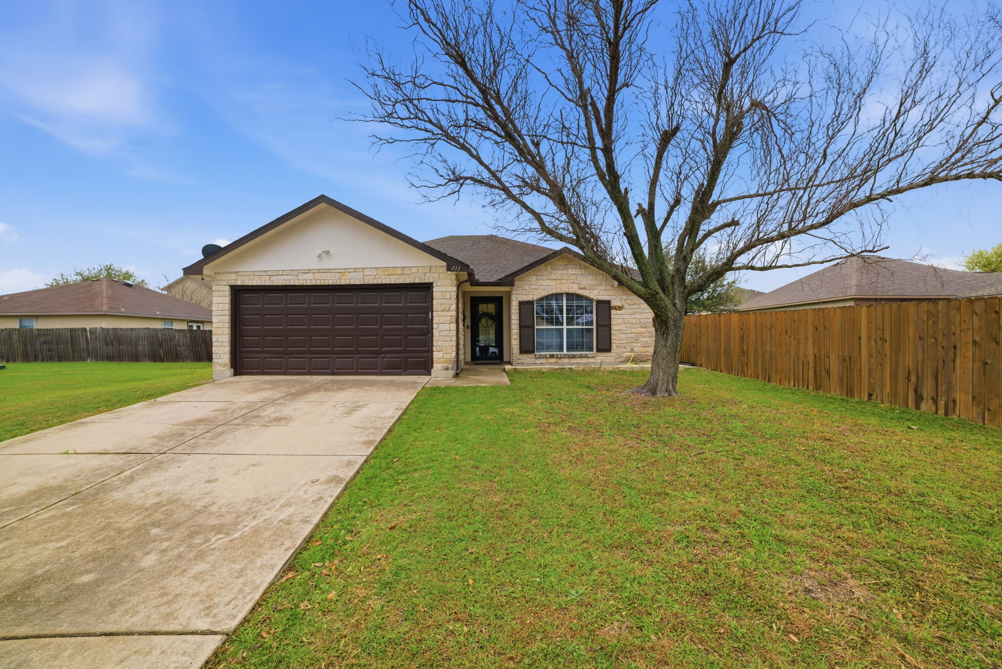 411 Copper Lane Jarrell, TX 76537 - Photo 2 of 32 Huge front yard and tons of parking in the driveway