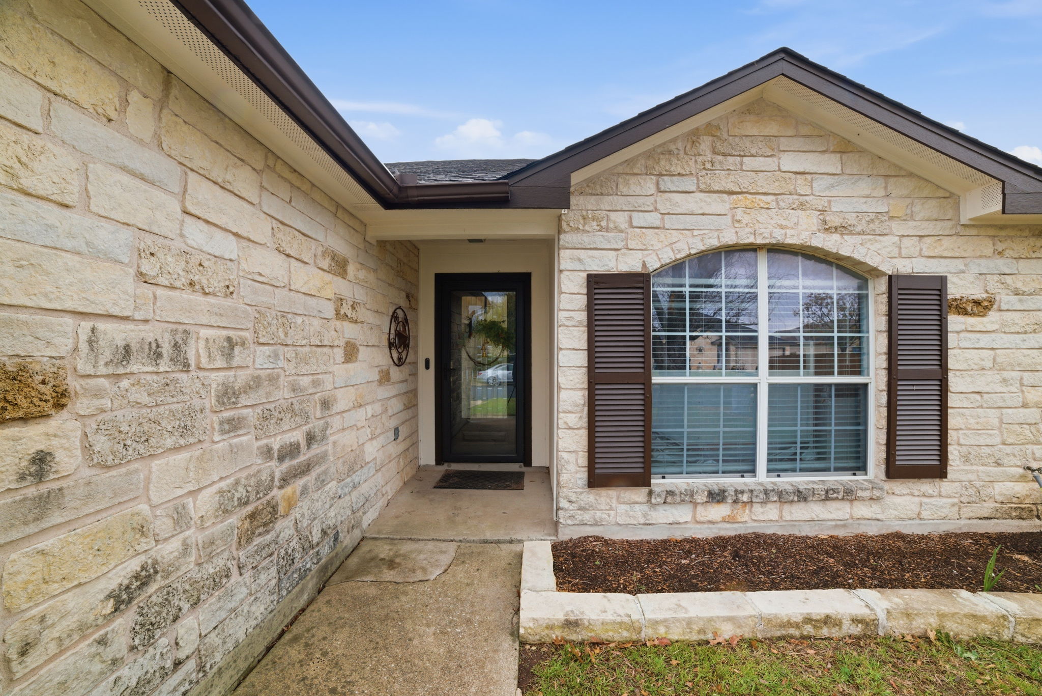 411 Copper Lane Jarrell, TX 76537 - Photo 4 of 32 Don't you just love this glass screen door? Being able to open the door to allow light in, while still keeping the cool air inside is a huge bonus in Texas!