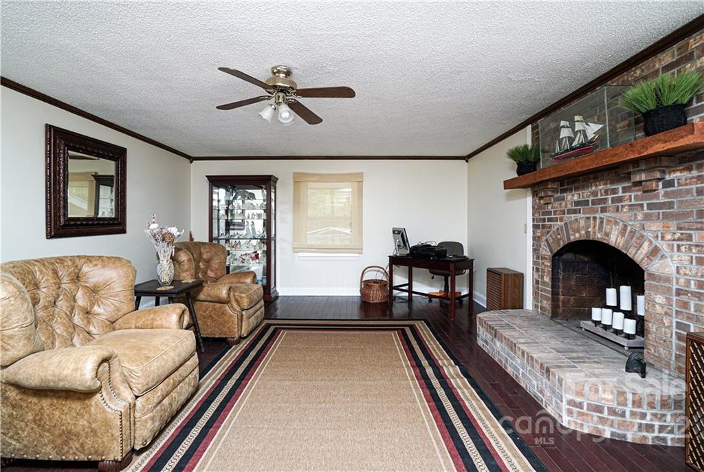 3349 Legend Road Lancaster, SC 29720 - Photo 18 of 48 a living room with furniture and a fireplace