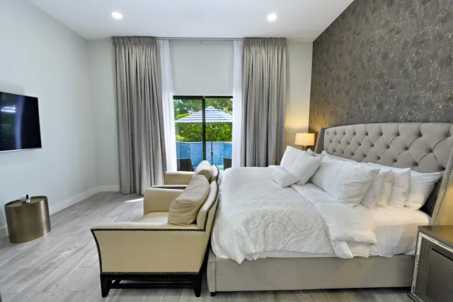 a bedroom with double bed and a window