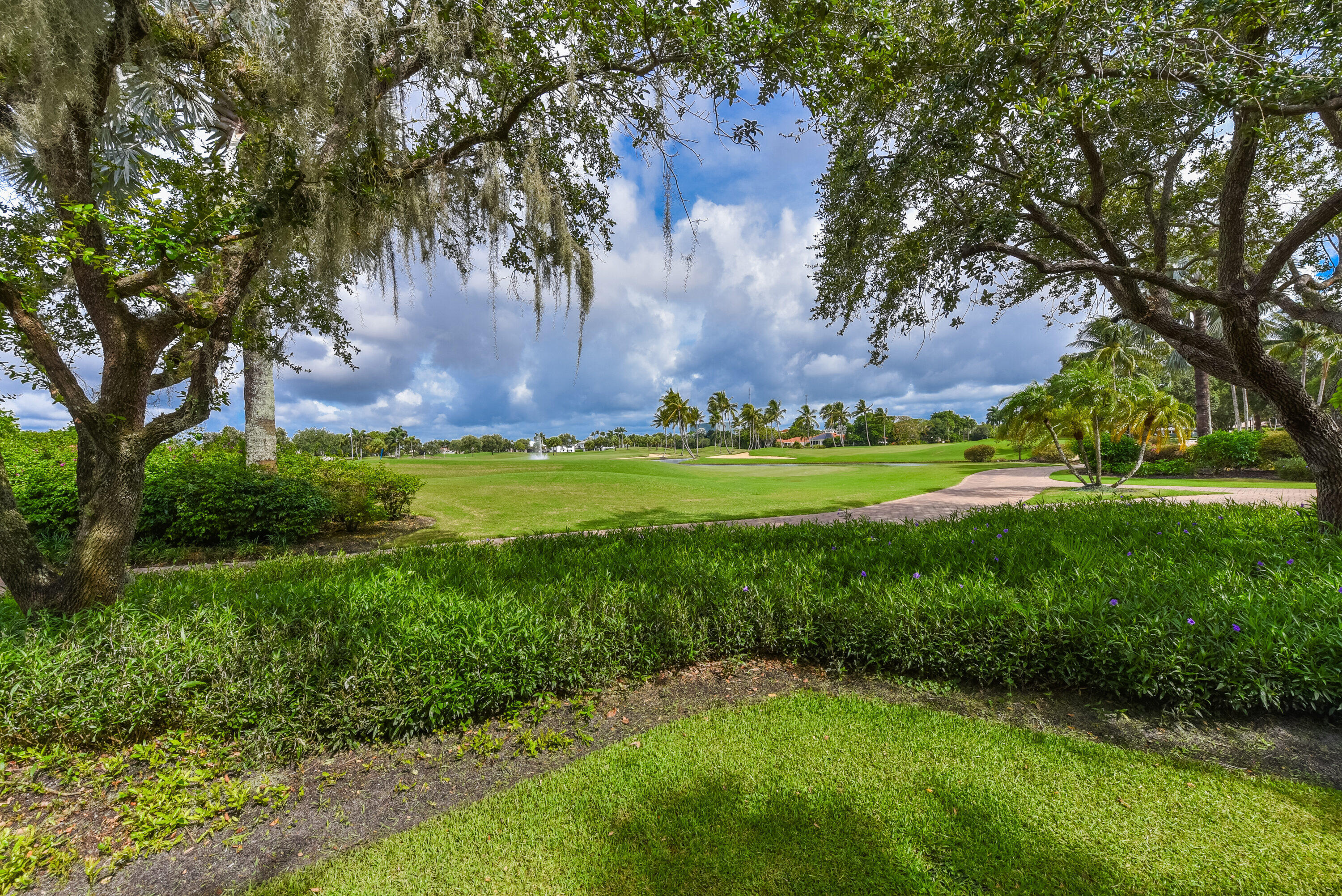 7493 Campo Florido Boca Raton, FL 33433 - Photo 32 of 62 a view of a grassy field with an trees
