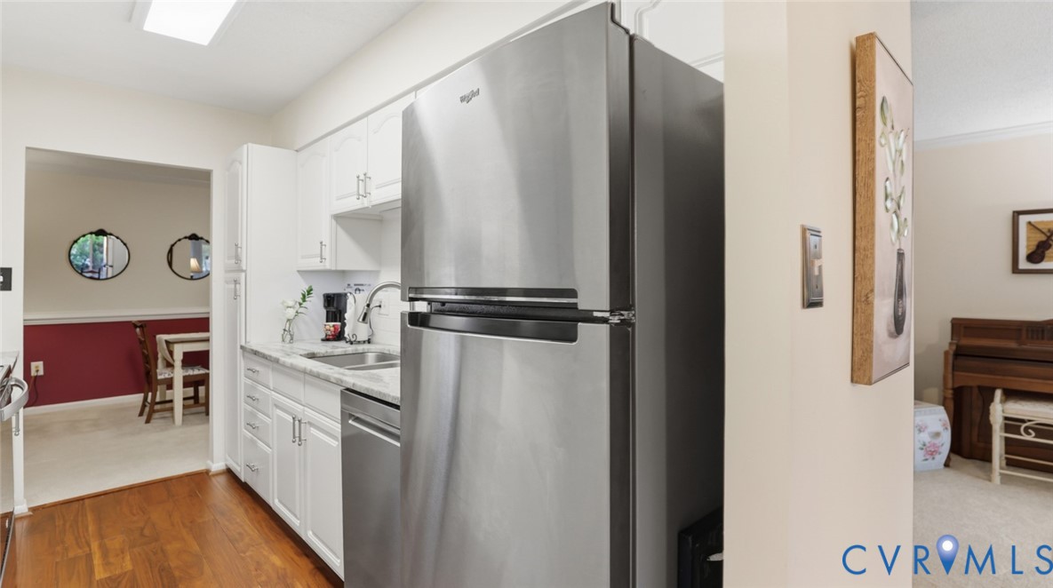 1513 Regency Woods Road, Unit 101 Henrico, VA 23238 - Photo 13 of 50 a kitchen with a refrigerator and a stove