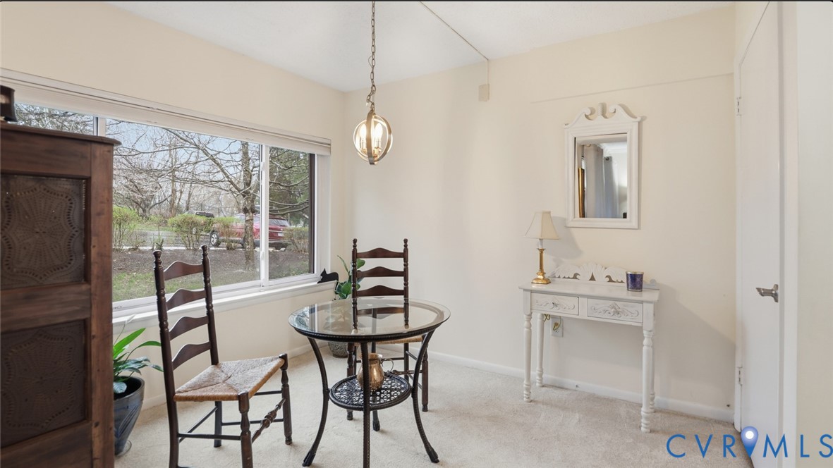 1513 Regency Woods Road, Unit 101 Henrico, VA 23238 - Photo 15 of 50 a view of a dining room with furniture window and outside view