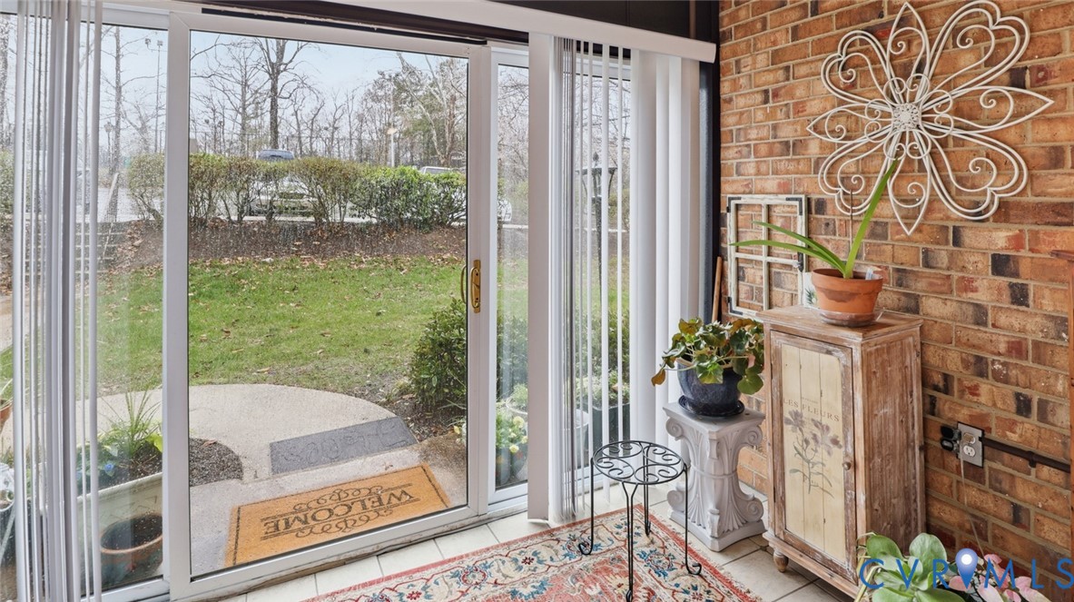 1513 Regency Woods Road, Unit 101 Henrico, VA 23238 - Photo 18 of 50 a bath room with a floor to ceiling window and a potted plant