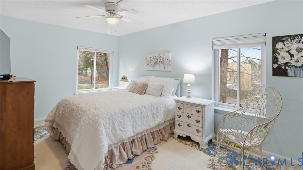 1513 Regency Woods Road, Unit 101 Henrico, VA 23238 - Photo 21 of 50 a bedroom with a large bed and a window
