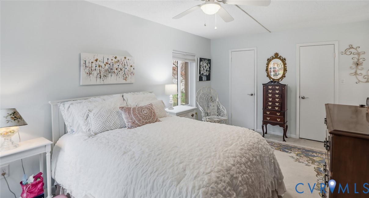 1513 Regency Woods Road, Unit 101 Henrico, VA 23238 - Photo 22 of 50 a spacious bedroom with a bed and a table in it