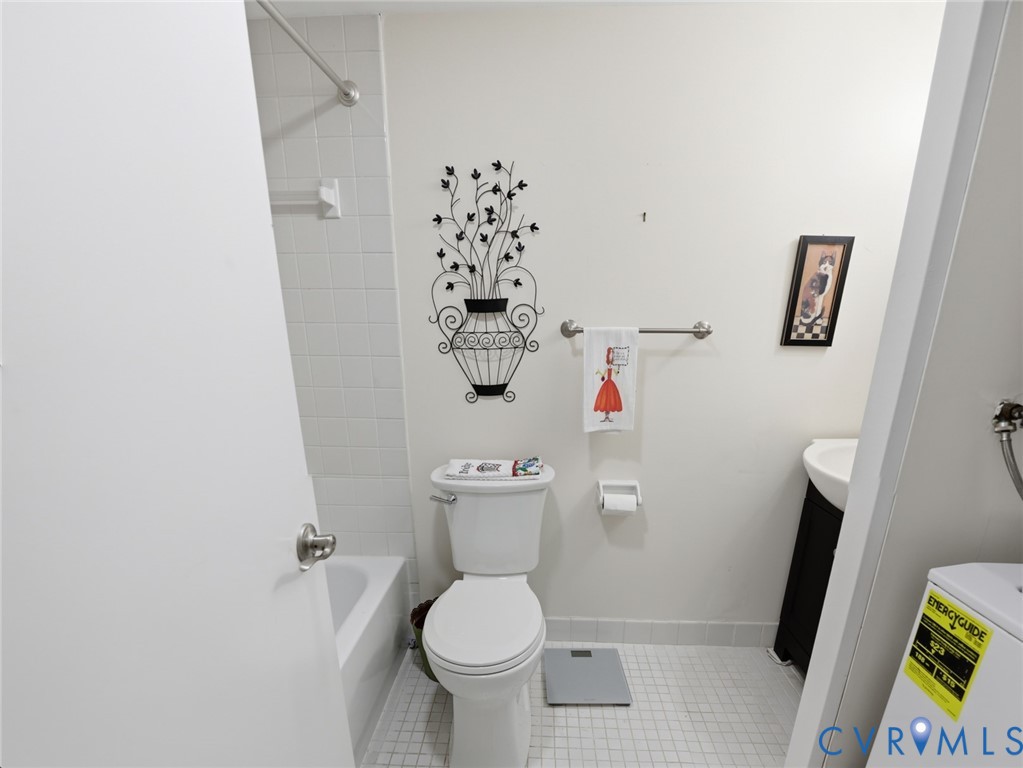 1513 Regency Woods Road, Unit 101 Henrico, VA 23238 - Photo 31 of 50 a white toilet sitting next to a shower curtain