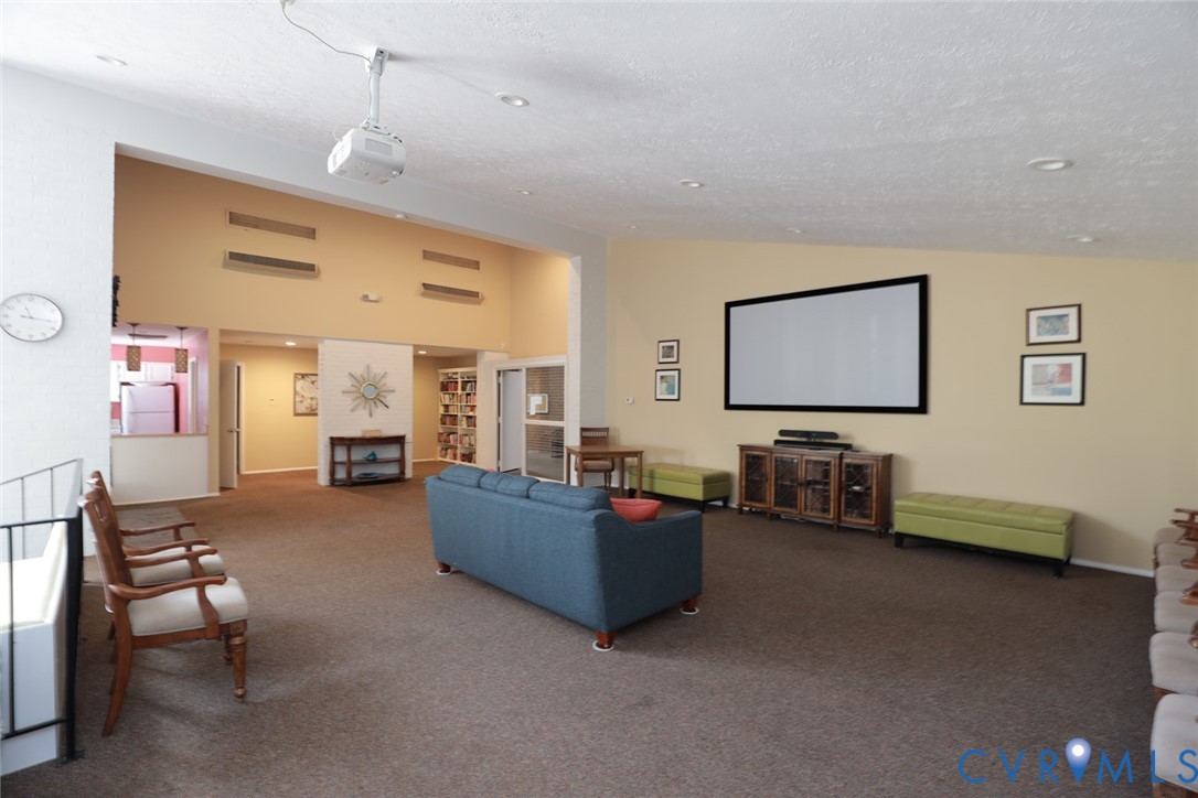 1513 Regency Woods Road, Unit 101 Henrico, VA 23238 - Photo 38 of 50 a living room with furniture and a flat screen tv