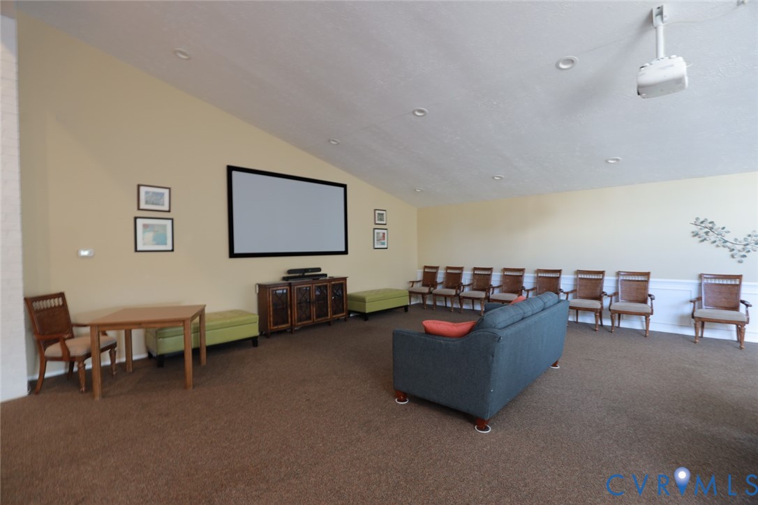 1513 Regency Woods Road, Unit 101 Henrico, VA 23238 - Photo 44 of 50 a living room with furniture and a flat screen tv