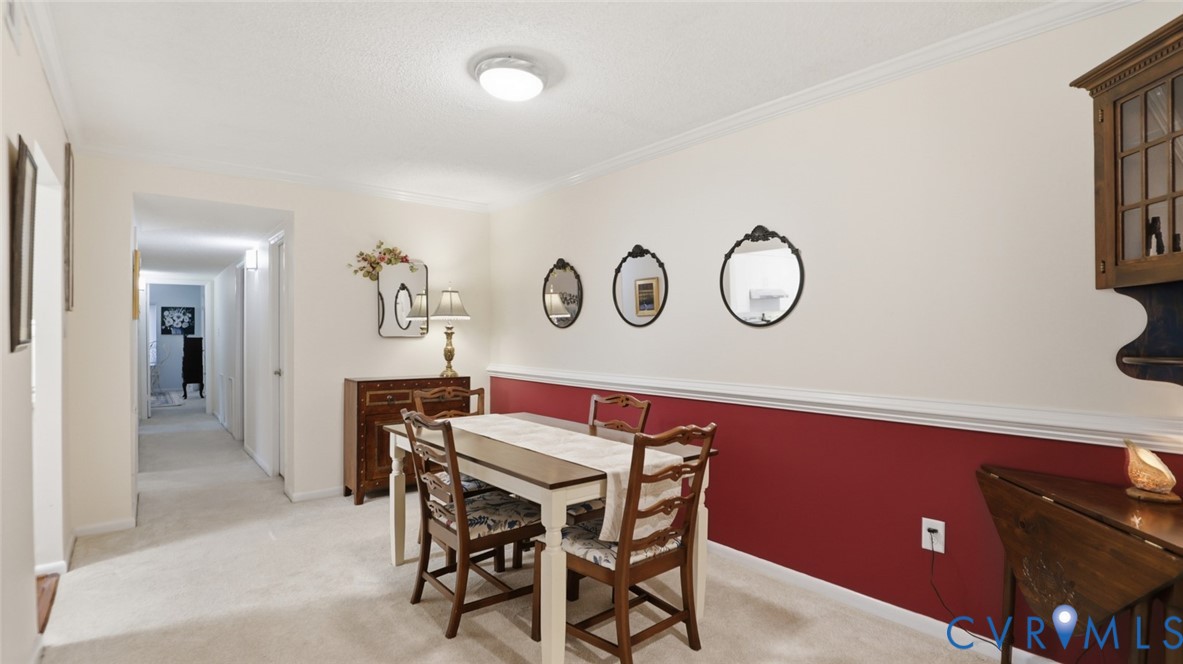1513 Regency Woods Road, Unit 101 Henrico, VA 23238 - Photo 8 of 50 a view of a dining room with furniture and a table