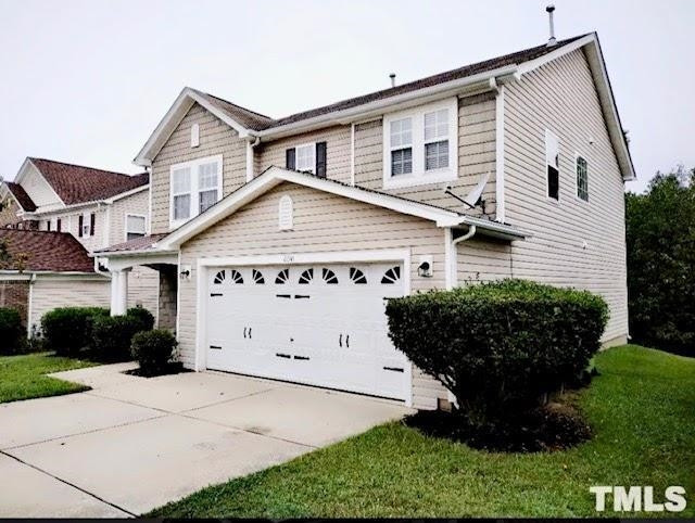 6041 Ricker Road Raleigh, NC 27610 - Photo 2 of 20 a view of a house with a garden