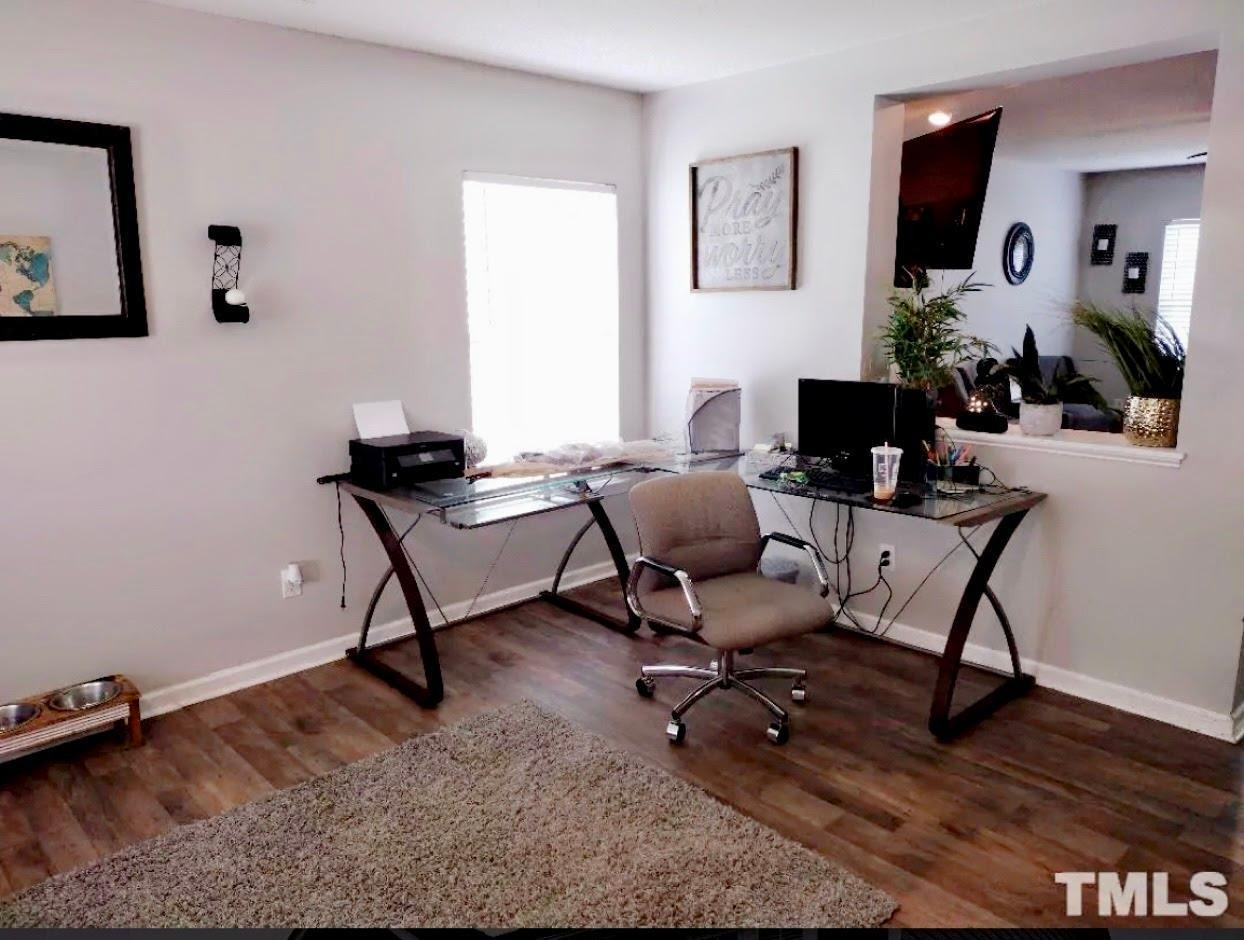 6041 Ricker Road Raleigh, NC 27610 - Photo 5 of 20 a view of a workspace with furniture and a window